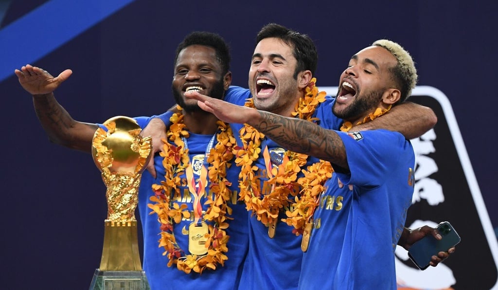 Foreign stars of Jiangsu Suning celebrate with the 2020 Chinese Football Super League trophy. They all face pay cuts under new the new salary cap. Photo: Xinhua Foreign stars of Jiangsu Suning celebrate with the 2020 Chinese Football Super League trophy. They all face pay cuts under new the new salary cap. Photo: Xinhua