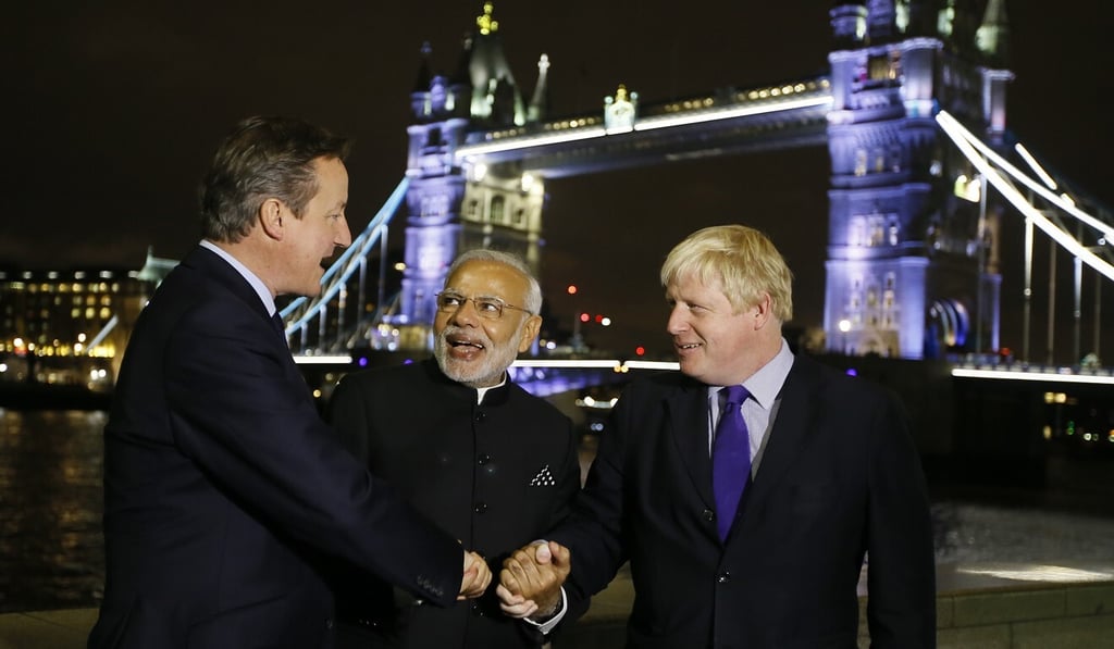 Johnson, right, pictured with Britain's then-prime minister David Cameron, left, during a three-day visit by Modi in 2015. Photo: AP Johnson, right, pictured with Britain's then-prime minister David Cameron, left, during a three-day visit by Modi in 2015. Photo: AP