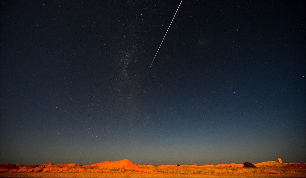 A capsule containing the samples of asteroid dust plummets to the ground in South Australia on December 6. Photo: AFP