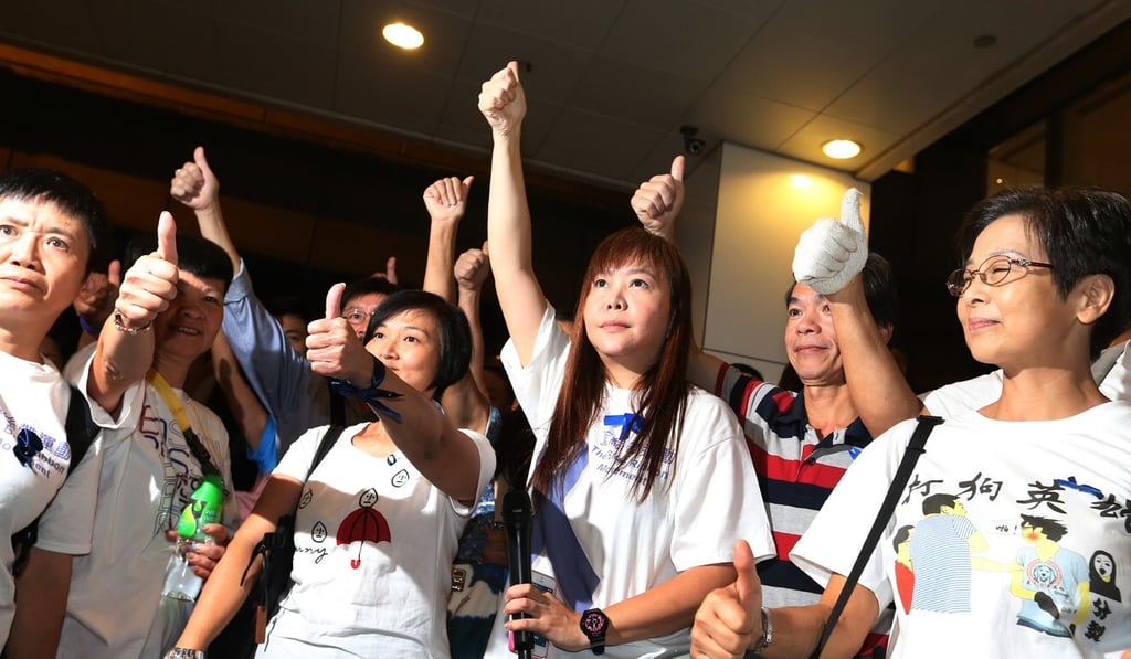 Leticia Lee (fourth from left) leads a counter-demonstration during Hong Kong’s Occupy Central movement in 2014. Photo: K. Y. Cheng Leticia Lee (fourth from left) leads a counter-demonstration during Hong Kong’s Occupy Central movement in 2014. Photo: K. Y. Cheng