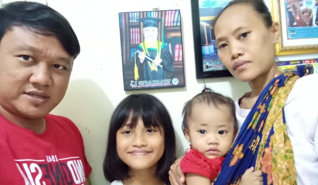 Lasmi Asih, right, pictured with her husband and two daughters. Photo: Handout Lasmi Asih, right, pictured with her husband and two daughters. Photo: Handout