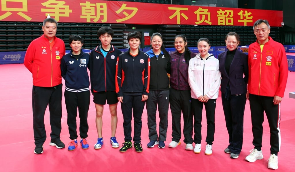 Doo Hoi-kem (fourth from left) with Chinese national team coaches and other members of the international team. Photo: ITTF Doo Hoi-kem (fourth from left) with Chinese national team coaches and other members of the international team. Photo: ITTF