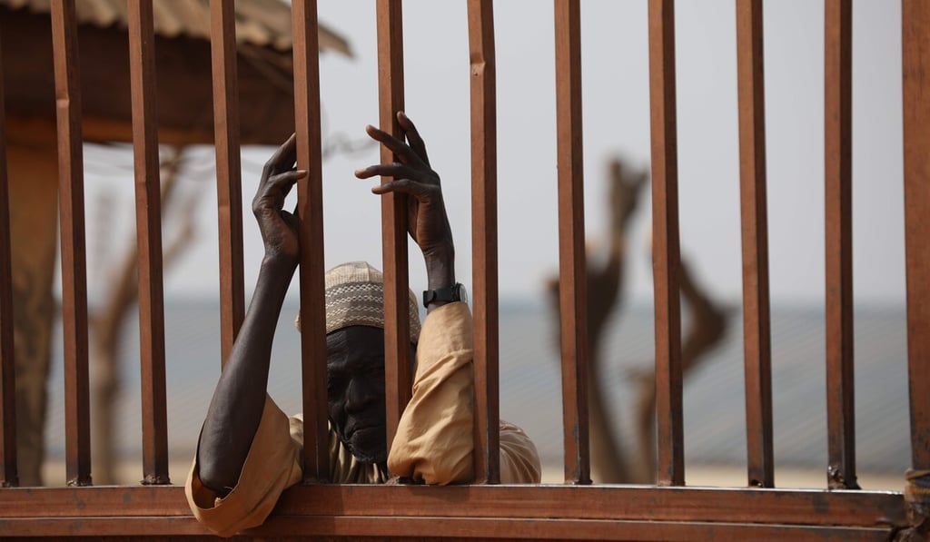 A parent waits outside the Government Science Secondary school in Kankara, Katsina state, on Wednesday. Photo: AFP A parent waits outside the Government Science Secondary school in Kankara, Katsina state, on Wednesday. Photo: AFP