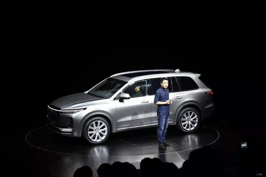 Li Xiang gives a Steve Jobs-style keynote in front of his Li Xiang One SUV. Photo: Sohu