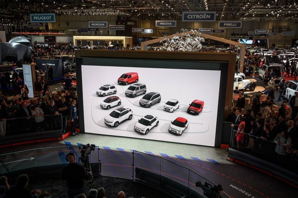 Citroen model cars displayed on a giant screen at the 2019 Geneva International Motor Show. Photo: AFP