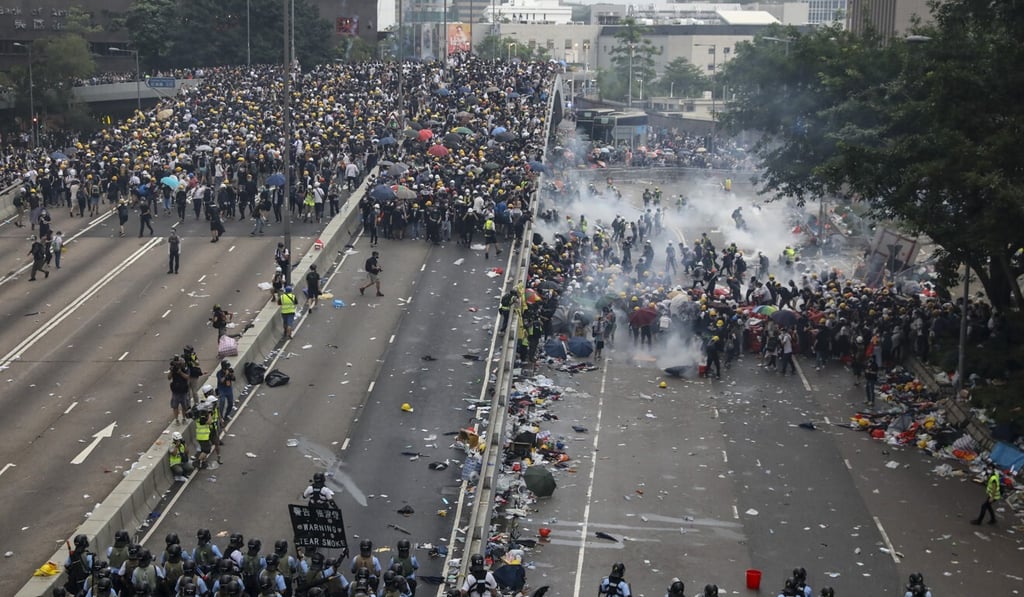 Police fire tear gas at protesters in Admiralty seeking to block the second reading of a controversial extradition bill on June 12, 2019. Photo: K. Y. Cheng Police fire tear gas at protesters in Admiralty seeking to block the second reading of a controversial extradition bill on June 12, 2019. Photo: K. Y. Cheng