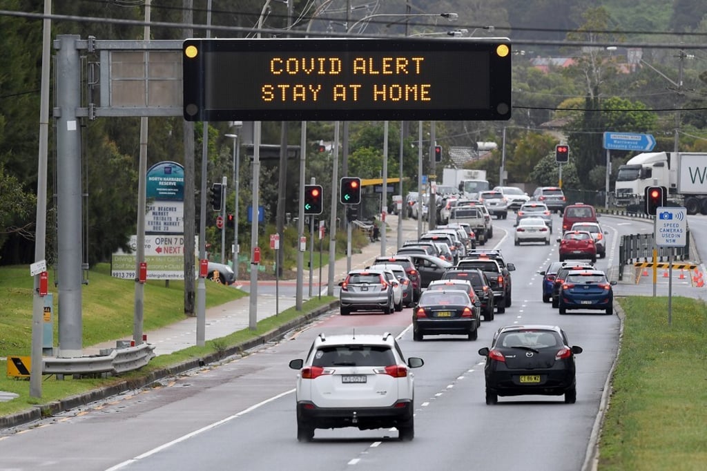 Cars queue at a drive-through Covid-19 testing line in Sydney on December 19, 2020. Photo: EPA-EFE