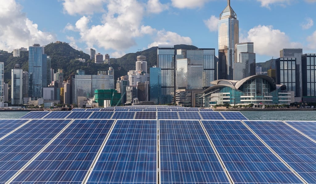 Solar panels against Hong Kong’s skyline. The city has pledged to eliminate carbon emissions by 2050. Solar panels against Hong Kong’s skyline. The city has pledged to eliminate carbon emissions by 2050.