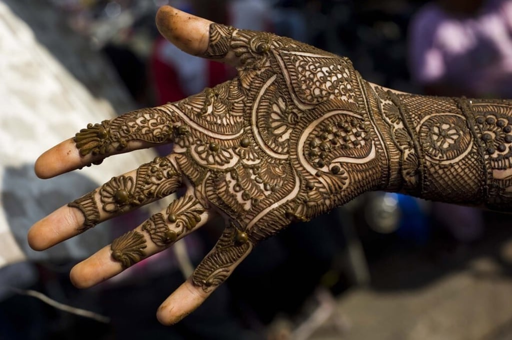 A girl gets a henna tattoo in a market in Jaipur, India. Photo: Getty Images A girl gets a henna tattoo in a market in Jaipur, India. Photo: Getty Images