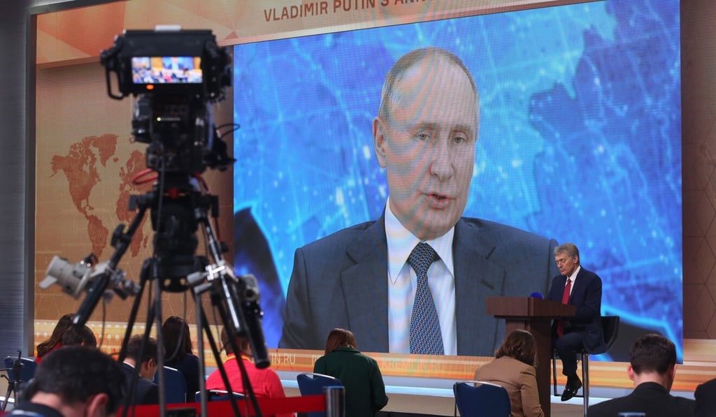 Russian President Vladimir Putin delivers his annual news conference via a large screen at the Crowne Plaza World Trade Centre in Moscow on Thursday. Photo: Bloomberg