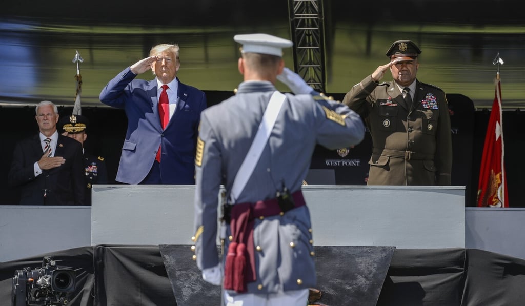 US President Donald Trump (left) and the US Military Academy superintendent Darryl A. Williams (right) salute graduating cadets at West Point in June. Photo: AP