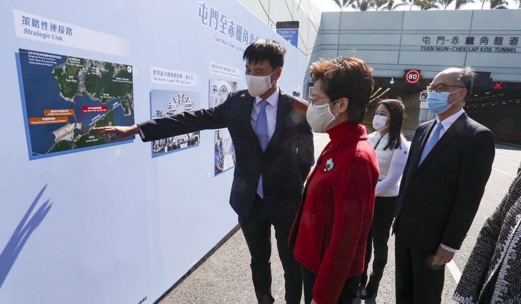 Chief Executive Carrie Lam (centre) and Secretary for Transport and Housing Frank Chan (far right) attend the opening ceremony for the Tuen Mun-Chek Lap Kok Link. Photo: Jonathan Wong Chief Executive Carrie Lam (centre) and Secretary for Transport and Housing Frank Chan (far right) attend the opening ceremony for the Tuen Mun-Chek Lap Kok Link. Photo: Jonathan Wong