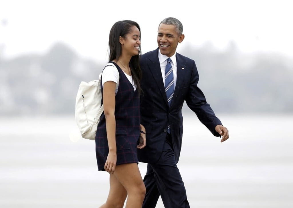 Then-president Barack Obama and daughter Malia at Los Angeles International Airport in April 2016. Photo: AP