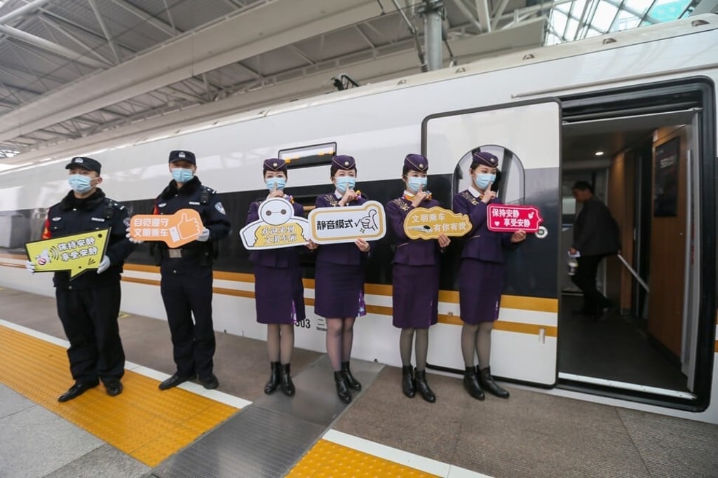 Train staff at Hongqiao Railway Station in Shanghai advertise the quiet carriage initiative in front of a high-speed train before it travels to Beijing. Photo: Xinhua Train staff at Hongqiao Railway Station in Shanghai advertise the quiet carriage initiative in front of a high-speed train before it travels to Beijing. Photo: Xinhua