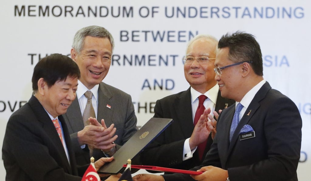 Malaysia and Singapore agreed to the rail project in 2016, with then-Malaysian Prime Minister Najib Razak, second right, and Singaporean Prime Minister Lee Hsien Loong, second left, witnessing the signing ceremony. Photo: EPA