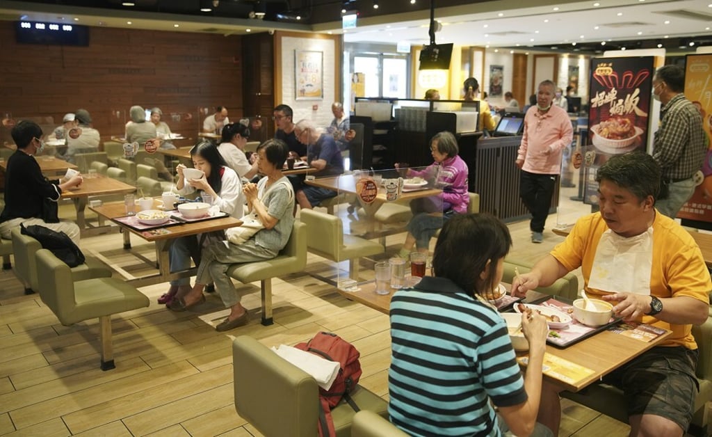 People enjoy lunch at a restaurant in Wong Tai Sin, while respecting Covid-19 measures. Photo: Winson Wong