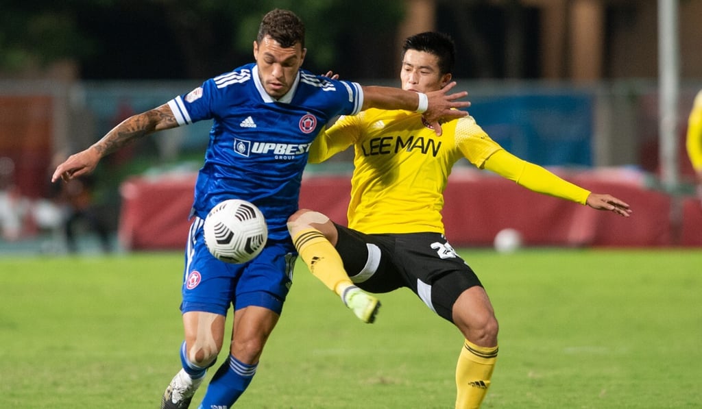 Everton Camargo, of Eastern, is challenged by Lee Man’s Wong Ho-chun in the Hong Kong Premier League. Photo: Hong Kong Football Association