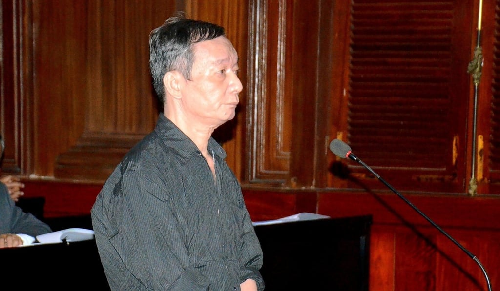 Nguyen Tuong Thuy stands in the dock during his trial. He received an 11-year prison sentence. Photo: Reuters