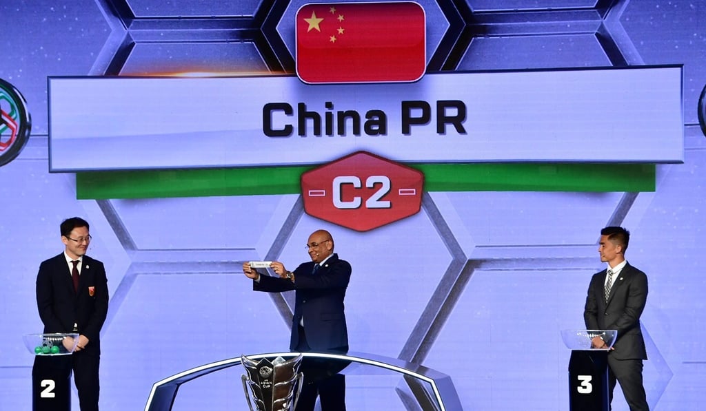AFC general secretary Windsor John displays the slip of the People's Republic of China during the final draw for the 2019 AFC Asian Cup. Photo: AFP