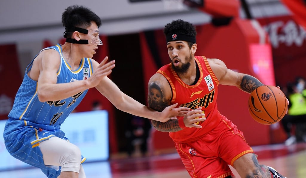 Askia Booker (right) of the Shenzhen Aviators breaks through against the Beijing Ducks in the Chinese Basketball Association. Photo: Xinhua Askia Booker (right) of the Shenzhen Aviators breaks through against the Beijing Ducks in the Chinese Basketball Association. Photo: Xinhua