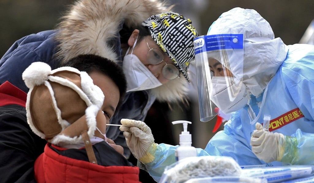 A swab is taken from a child in Shijiazhuang on Sunday. A new round of mass testing will begin in the city of 11 million on Tuesday. Photo: AP A swab is taken from a child in Shijiazhuang on Sunday. A new round of mass testing will begin in the city of 11 million on Tuesday. Photo: AP