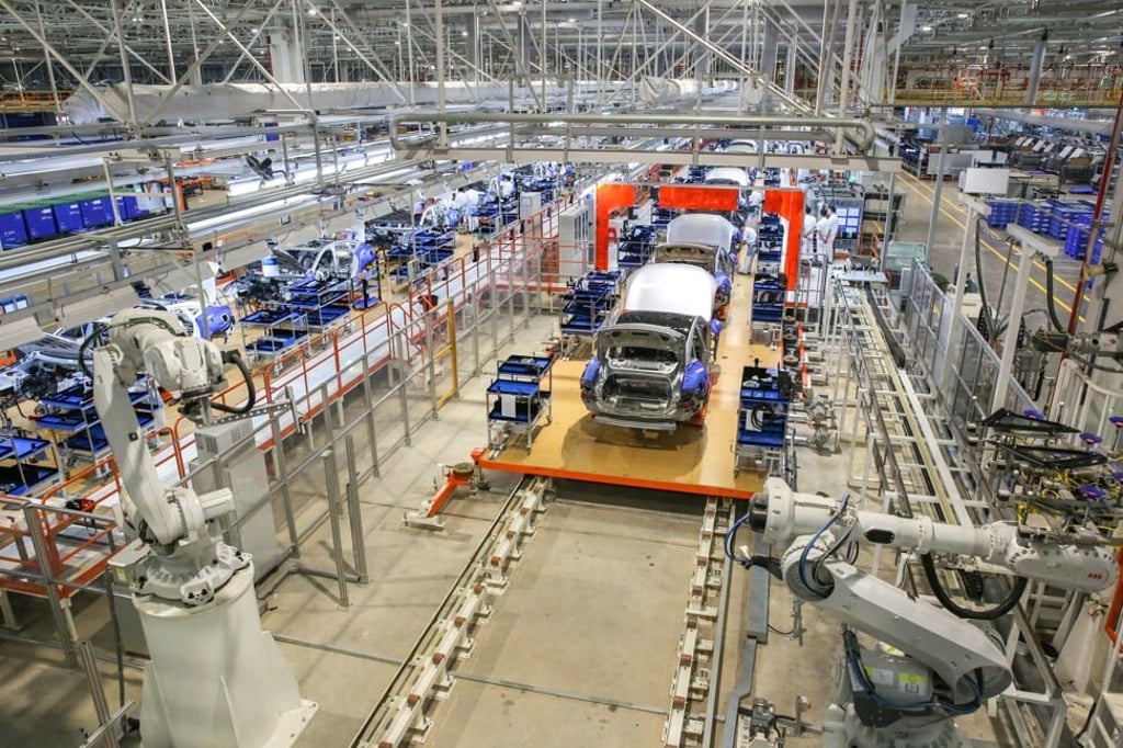 Electric cars on the assembly line at Xpeng’s new factory in the Guangdong provincial city of Zhaoqing in November. Photo: Iris Ouyang