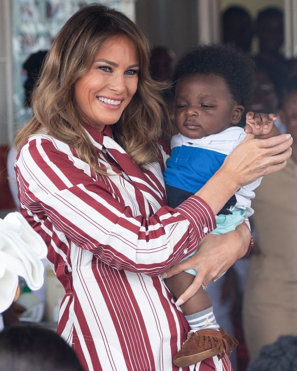 Melania Trump holds a baby during a visit to Accra, Africa, in 2018 to promote her Be Best campaign. Photo: AFP
