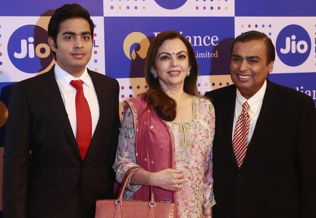 Mukesh Ambani, Nita and Akash at the Reliance Industries’ annual general meeting in Mumbai, India, in 2016. Photo: AP