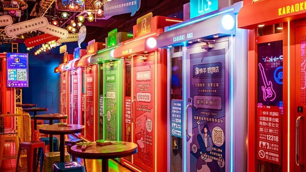 Kuaishou opens a karaoke store in Guangzhou where customers can either sing on a public stage or entertain themselves in a soundproof cubicle equipped with a screen, microphones and earphones. Photo: Handout Kuaishou opens a karaoke store in Guangzhou where customers can either sing on a public stage or entertain themselves in a soundproof cubicle equipped with a screen, microphones and earphones. Photo: Handout