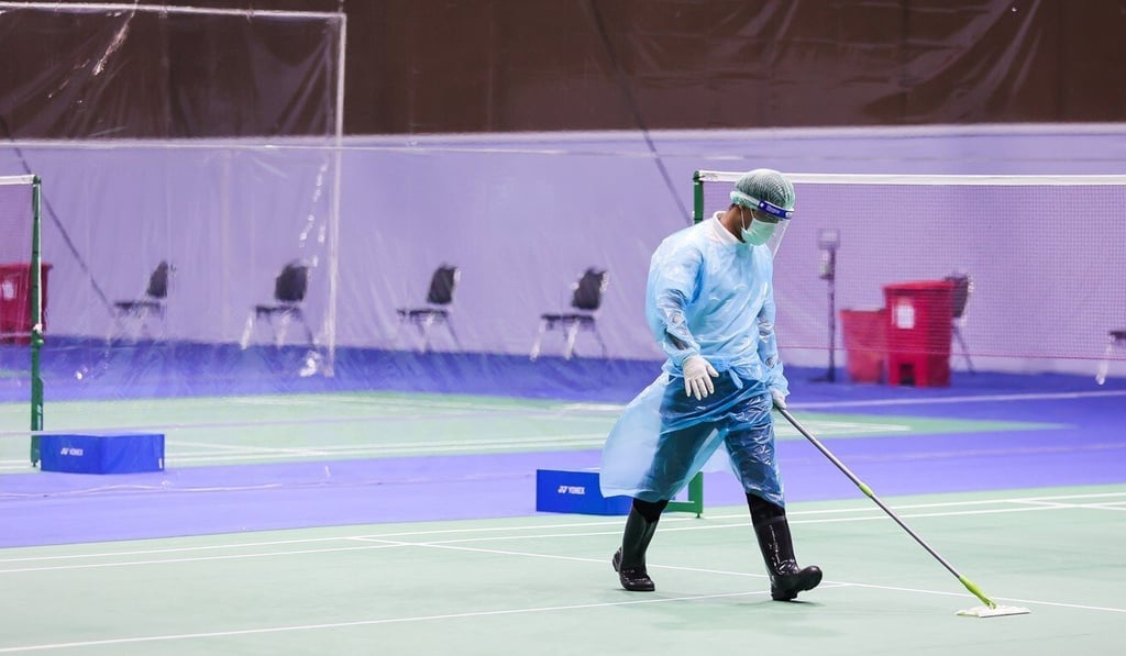 A worker disinfects the courts in Bangkok. Photo: Reuters