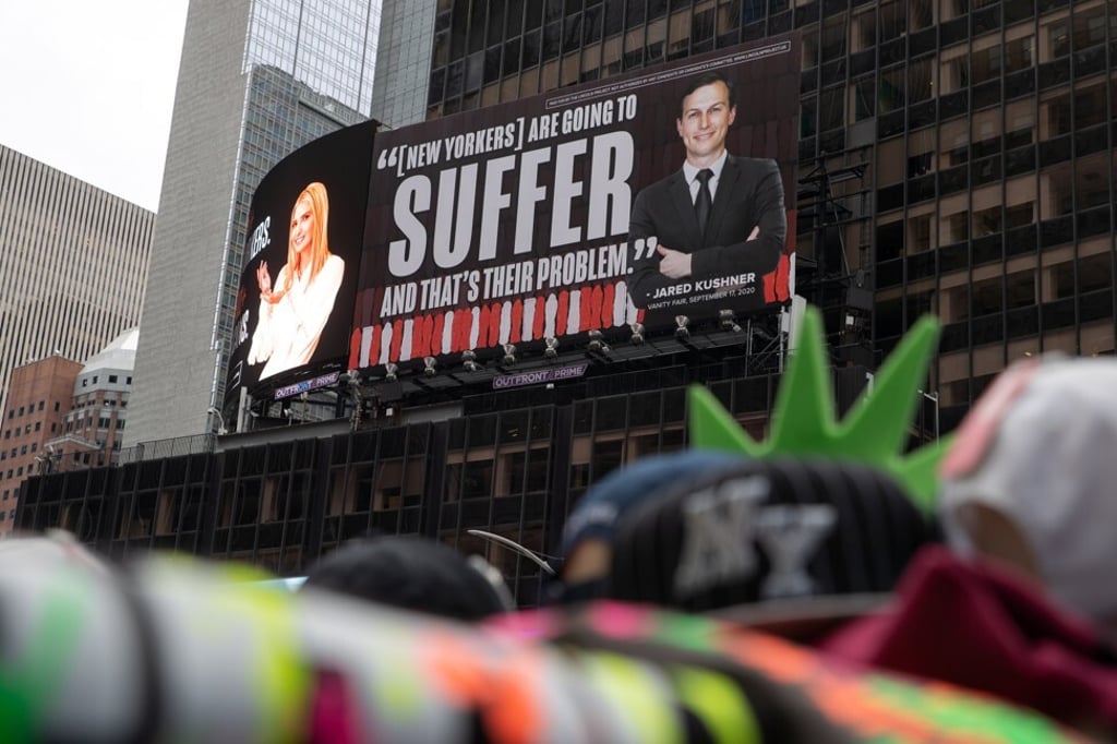Images of Ivanka Trump and Jared Kushner are seen alongside messages about Covid-19 infections and deaths on billboards sponsored by The Lincoln Project above Times Square in New York City in October 2020. Photo: Reuters