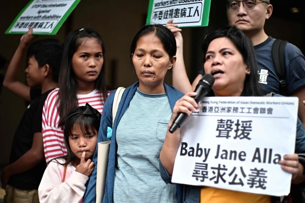 Baby Jane Allas, centre, after a hearing at the Labour Tribunal in Hong Kong on April 15, 2019, which ordered her former employer to pay a settlement of HK$30,000. Photo: AFP