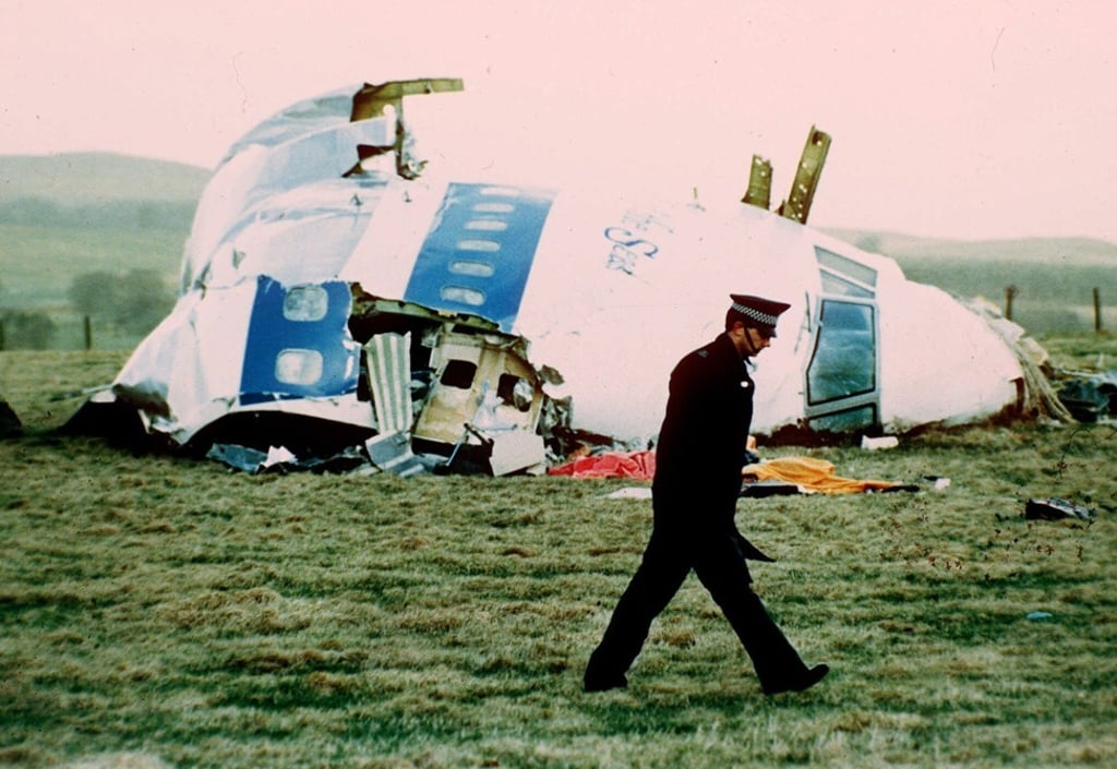 A police officer walks by the nose of Pan Am flight 103 in a field near the town of Lockerbie, Scotland in 1988. Photo: AP