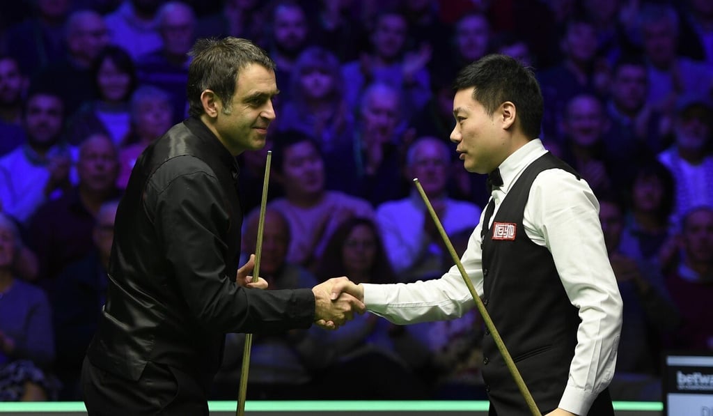 Ronnie O'Sullivan shakes the hand of Ding Junhui after the fourth round of the Betway UK Championship at The Barbican in December, 2019. Photo: Getty Images