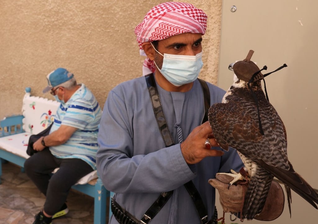 A falconer holds his bird at the historic Al Fahidi neighbourhood, in Dubai. Photo: AFP A falconer holds his bird at the historic Al Fahidi neighbourhood, in Dubai. Photo: AFP