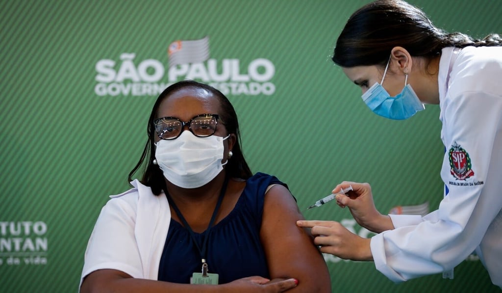 Monica Calazans, a nurse at the Hospital las Clinicas in the Brazilian capital of Sao Paulo, receives the Covid-19 vaccine on Sunday. Photo: EPA-EFE