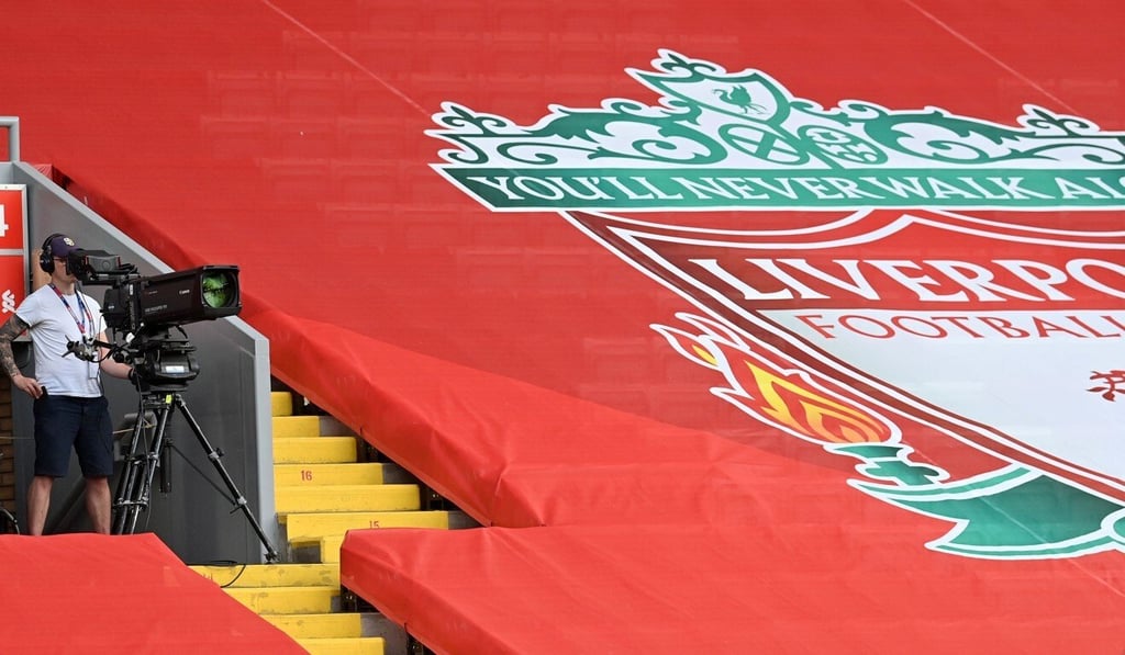 A television broadcast camera operator works ahead of the English Premier League match between Liverpool and Crystal Palace at Anfield in June 2020. Photo: AFP