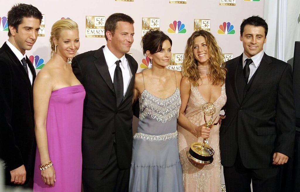 From left, the cast of Friends: David Schwimmer, Lisa Kudrow, Matthew Perry, Courtney Cox Arquette, Jennifer Aniston and Matt LeBlanc, with their Emmy for outstanding comedy series in September 2002. Photo: AFP