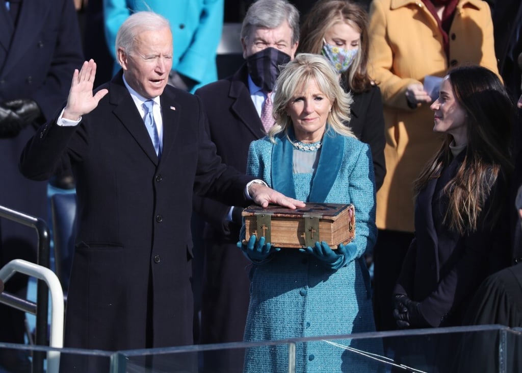 US president Joe Biden stands with his wife Jill, the new first lady, as he is given the oath of office by Chief Justice John Roberts of the Supreme Court during the inaugural ceremony. Photo: EPA-EFE