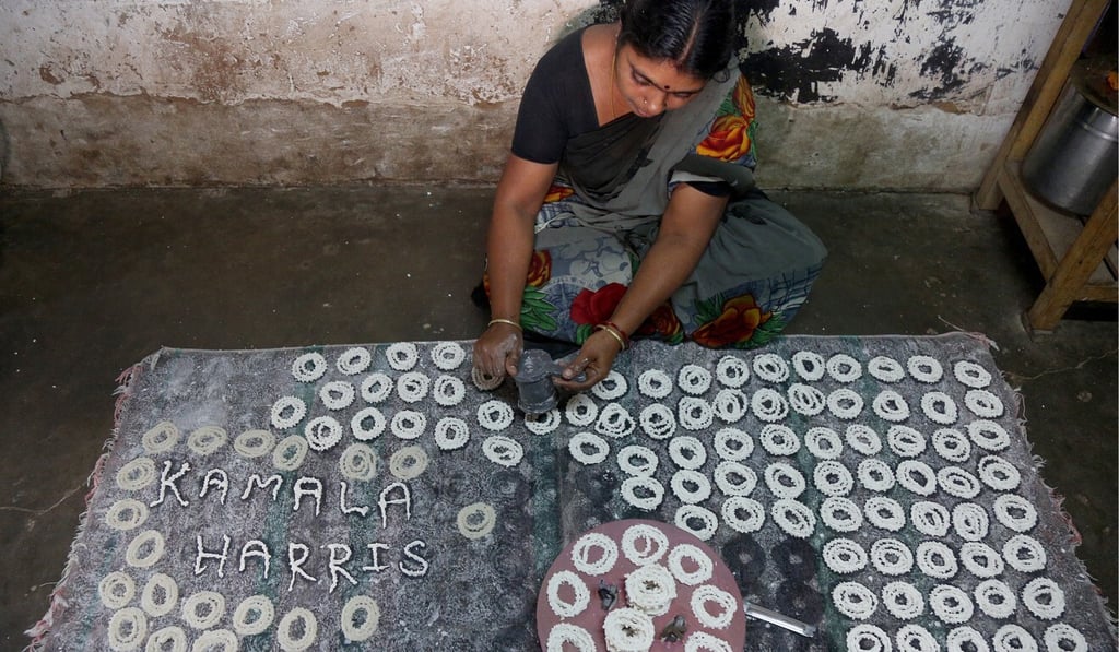A villager prepares food with US Vice-President Kamala Harris' name displayed at Thulasendrapuram village on Wednesday. Photo: EPA-EFE A villager prepares food with US Vice-President Kamala Harris' name displayed at Thulasendrapuram village on Wednesday. Photo: EPA-EFE