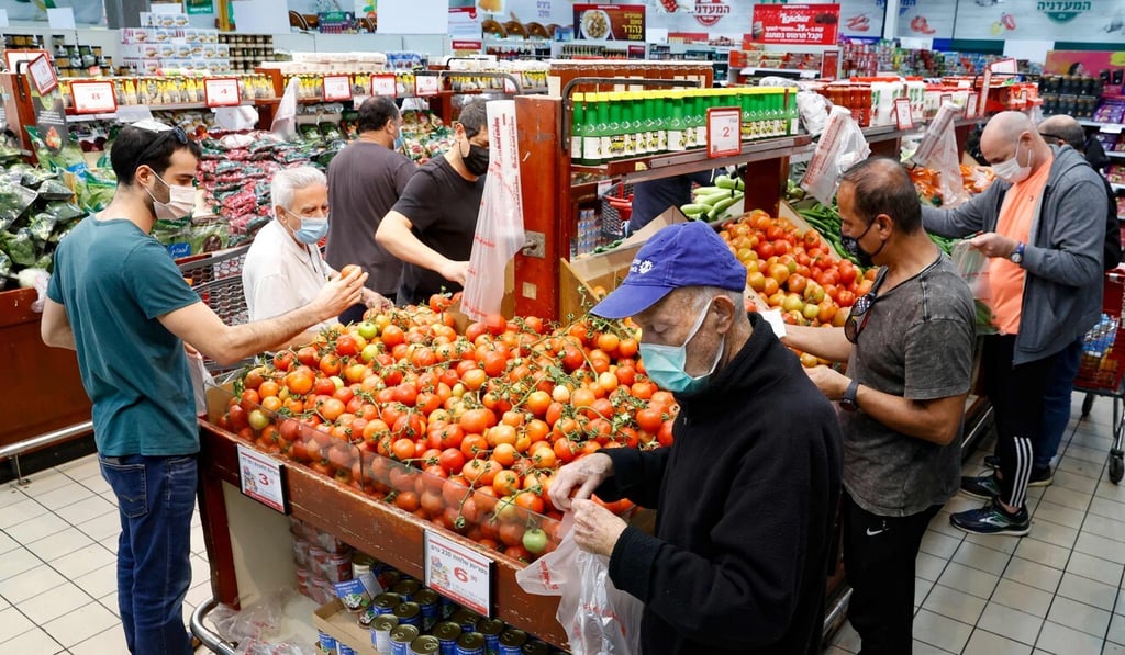 Israelis shop for food supplies at a supermarket in Bnei Brak. Photo: AFP Israelis shop for food supplies at a supermarket in Bnei Brak. Photo: AFP