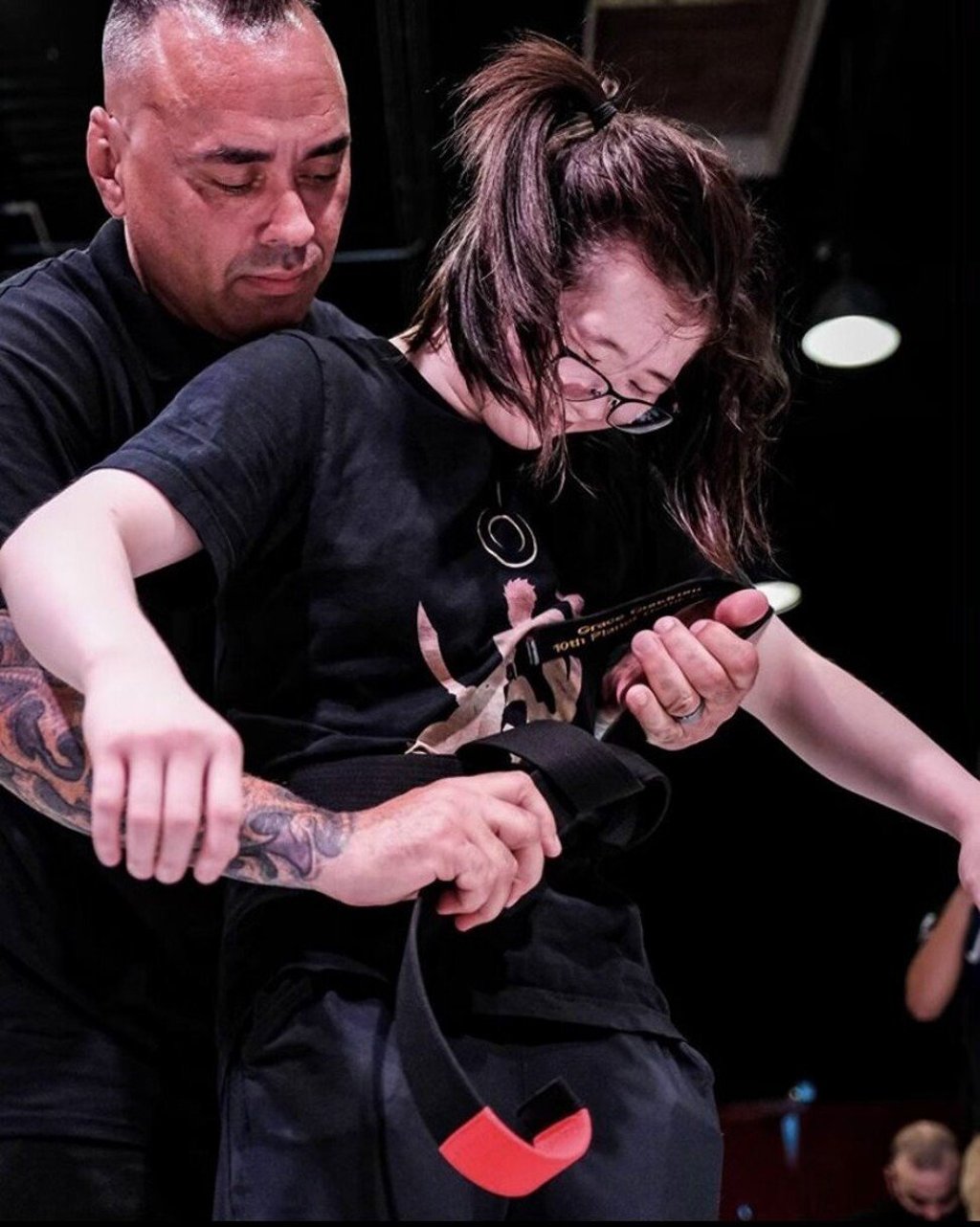 American jiu jitsu competitor Grace Gundrum receives her black belt from Eddie Bravo in July of last year. Photo: Handout