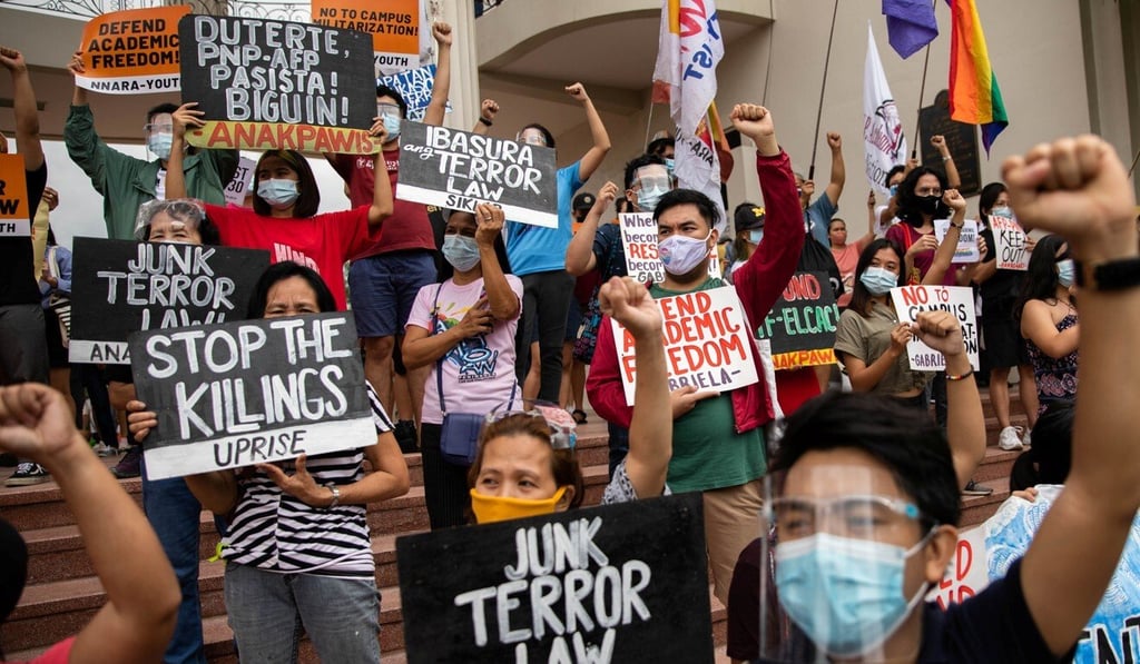 Students and activists stage a protest earlier this month following the defence ministry's cancellation of a decades-long pact hindering police and soldiers from entering the University of the Philippines. Photo: Reuters Students and activists stage a protest earlier this month following the defence ministry's cancellation of a decades-long pact hindering police and soldiers from entering the University of the Philippines. Photo: Reuters