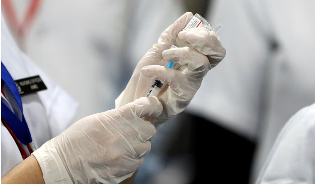 A health care worker fills a syringe with a dose of Bharat Biotech's Covid-19 vaccine in New Delhi, India. Photo: Reuters