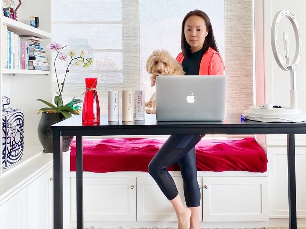 Yeeli Lee works at a standing desk with her pet dog Rocky. She had to make major changes to her work life last year when the Covid-19 pandemic struck. Photo: Courtesy of Yeeli Lee