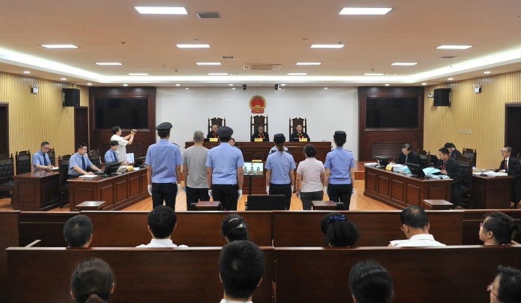 A photo taken inside Harbin Intermediate People’s Court on July 19, 2016, shows defendants Zhang Mingjie (right, flanked by policewomen) and co-accused Wang Shaoyu at their corruption trial. Photo: Harbin Intermediate People’s Court A photo taken inside Harbin Intermediate People’s Court on July 19, 2016, shows defendants Zhang Mingjie (right, flanked by policewomen) and co-accused Wang Shaoyu at their corruption trial. Photo: Harbin Intermediate People’s Court