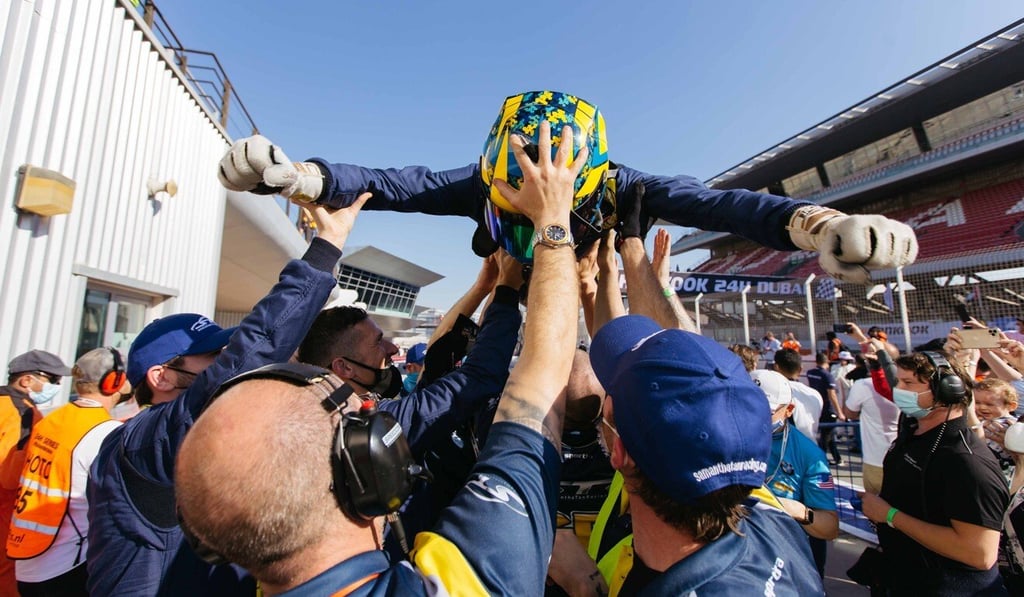 Samantha Tan’s teammate, Nick Wittmer, is lifted up after their historic victory.