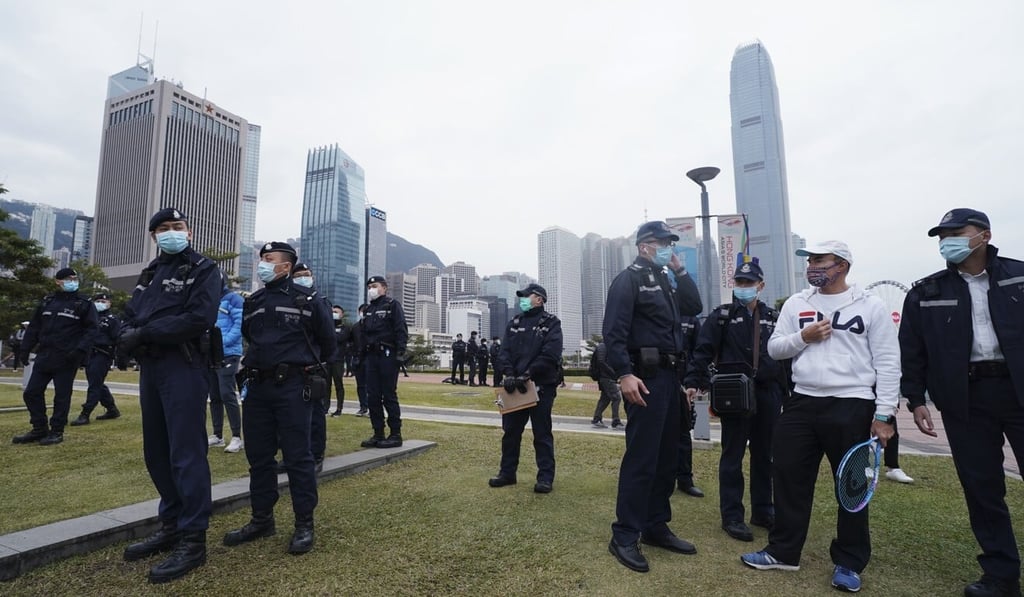 Police shut down a gathering of tennis players at Tamar Park who are unhappy the sport is still banned under social-distancing regulations. Photo: Felix Wong