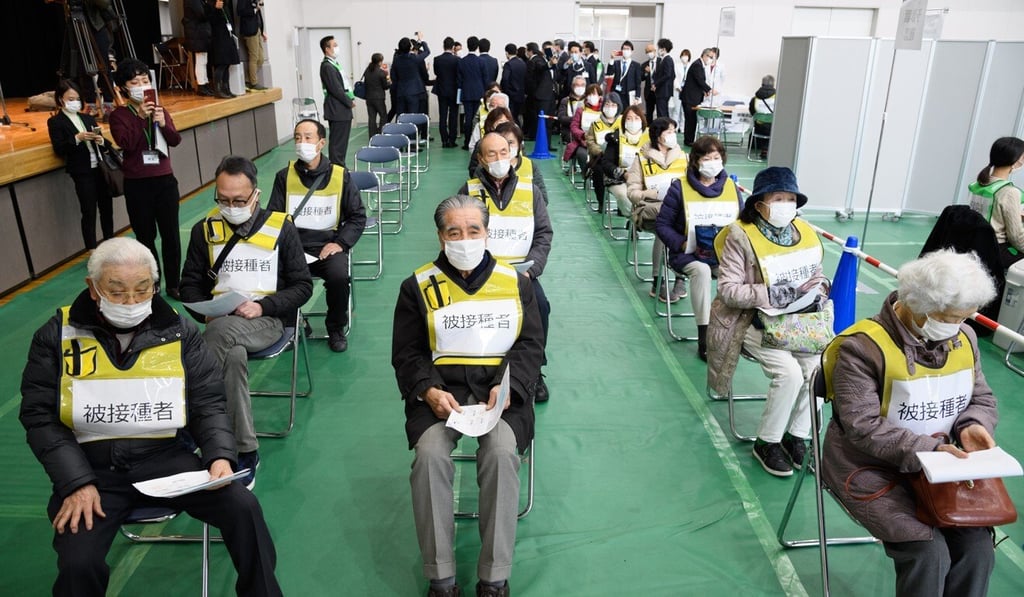 Volunteers take part in a vaccination simulation at a gymnasium in Kawasaki. Photo: Bloomberg Volunteers take part in a vaccination simulation at a gymnasium in Kawasaki. Photo: Bloomberg