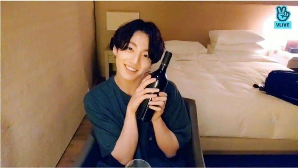 Jungkook of K-pop group BTS with a bottle of Italian red wine. Photo: @BTS/V Live